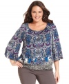 Enliven your neutral bottoms with Style&co.'s three-quarter-sleeve plus size top, featuring a vibrant print.