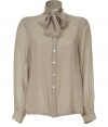 Channel sexy secretary style in this ultra-stylish tie-neck silk blouse from Raoul - Stand collar with tie detail, front button placket, long sleeves with gathering at cuffs - Style with cropped trousers, a slim blazer, and classic pumps