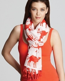 Rock a Moroccan look in this breezy kate spade new york scarf featuring a fun, flame-colored camel print and exotic tassels.