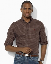 An essential sport shirt is crafted from lightweight woven cotton and tailored for a trim, modern fit. An essential sport shirt is crafted from lightweight woven cotton and tailored for a trim, modern fit.