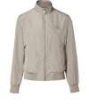 Casual yet classic, this showerproof blouson jacket from Burberry Brit offers effortless style - Stand-up collar, long sleeves, ribbed knit cuffs and hemline, front zip closure, zippered pockets, embroidered logo at chest - Fitted - The perfect choice for travel - comes with a packaway bag