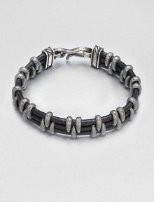 A modern look with textural detail crafted in a mix of leather wrapped with stippled sterling silver.LeatherSterling silverAbout 2½ diam.Imported A modern look with textural detail crafted in a mix of leather wrapped with stippled sterling silver.LeatherSterling silverAbout 2½ diam.Imported