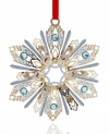 Ice-blue accents and radiant gold-plated brass give ChemArt's Jeweled Snowflake ornament a look of timeless holiday splendor.