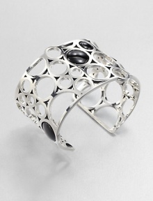 From the Regitze Collection. A striking, sculptural open cuff formed of cutout circles of gleaming sterling silver, dotted with discs of rich black agate.Black agateSterling silverDiameter, about 2¼Width, about 1¾Imported From the Regitze Collection. A striking, sculptural open cuff formed of cutout circles of gleaming sterling silver, dotted with discs of rich black agate.Black agateSterling silverDiameter, about 2¼Width, about 1¾Imported