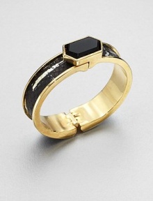 A goldtone cuff accented in luxurious python inlay with a hexagonal black onyx stone. Black onyxGoldtonePythonDiameter, about 2Hinged closureMade in USA A goldtone cuff accented in luxurious python inlay with a hexagonal black onyx stone. Black onyxGoldtonePythonDiameter, about 2Hinged closureMade in USA