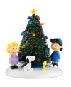 The cutest kids from Peanuts Village get together to decorate the Christmas tree, stringing lights and singing carols in a scene that would even raise Charlie Brown's spirits. From Department 56.