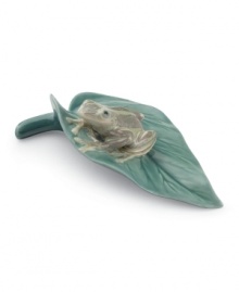 More shiny than slimy, the tiny Cloqui frog is quite a prince, perched on his own leaf in this meticulously handcrafted Lladro collectible. More shiny than slimy, the tiny Cloqui frog is quite a prince, perched on his own leaf in this meticulously handcrafted Lladro collectible.