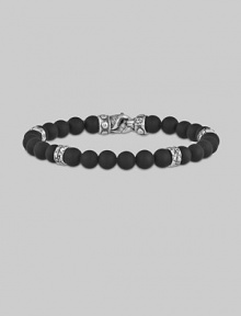 A strand of dramatic matte-finish black onyx beads, with a bold clasp and stations of hand-forged sterling silver.8mm matte onyx beads Sterling silver Length, about 9 Lobster clasp Made in USA A strand of dramatic matte-finish black onyx beads, with a bold clasp and stations of hand-forged sterling silver.8mm matte onyx beads Sterling silver Length, about 9 Lobster clasp Made in USA