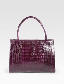 Luxurious crocodile top-handle design, perfectly sized for all your essentials.Double top handles, 5½ dropOpen topThree inner compartments; one zippered and two openOne inside zip pocketTwo inside open pocketsTwo pen holdersSuede lining11W X 8½H X 5DMade in Italy Luxurious crocodile top-handle design, perfectly sized for all your essentials.Double top handles, 5½ dropOpen topThree inner compartments; one zippered and two openOne inside zip pocketTwo inside open pocketsTwo pen holdersSuede lining11W X 8½H X 5DMade in Italy