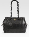 Calfskin leather in a duffle silhouette, topped with chain handles.Plexiglas® double top handles, 11 dropSpring hinge closureMetal letting logoBrass hardwareProtective metal feetOne inside open pocketOne inside zip pocketPrada logo fabric lining11W X 12½H X 5½DMade in Italy