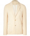 Stylish blazer made ​.​.of fine, light beige cotton blend - Updated version of the classic blazer - With moderately deep lapels, two-button front - Two side patch pockets and breast pocket  - Slim, slightly fitted shape - Ideal jacket for many summer occasions and office ensembles - Pair with dark jeans and boots, wear over a thin cashmere pullover