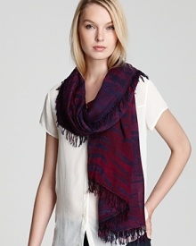 A navy-and-purple tiger print and all-over fringe give this oblong scarf from Theodora & Callum a casual-cool vibe.