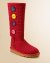 Fun, colorful felt buttons add a touch of whimsy to this knit design with a molded EVA outsole and a sheepskin insole for everyday comfort.Wool and acrylic upper Button closure EVA outsole Sheepskin insole Logo tab on heel Imported