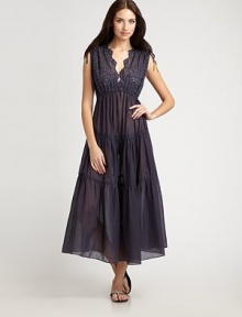 An elegant take on the traditional swim coverup, this style features extraordinary sartorial nuances like bedecked ribbon at the shoulders and gorgeous embroidery. V-neckElastic waistCottonHand washImported