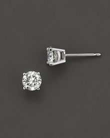 Traditional four prong round diamond stud earring in a white gold setting. Traditional four prong round diamond stud earring in a white gold setting.