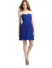 THE LOOKStrapless sweetheart necklineRuched sidesInterior soft bra cupsBoned bodicePleated skirt with ruffle hemSide zipperTHE FITAbout 27 from top to hemTHE MATERIALPolyesterFully linedCARE & ORIGINDry cleanImportedModel shown is 5'11 (180cm) wearing US size Small.This item was originally available for purchase at Saks Fifth Avenue OFF 5TH stores. THE LOOKStrapless sweetheart necklineRuched sidesInterior soft bra cupsBoned bodicePleated skirt with ruffle hemSide zipperTHE FITAbout 27 from top to hemTHE MATERIALPolyesterFully linedCARE & ORIGINDry cleanImportedModel shown is 5'11 (180cm) wearing US size Small.This item was originally available for purchase at Saks Fifth Avenue OFF 5TH stores.
