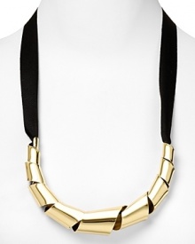 MARC BY MARC JACOBS gives a girlie favorite a hard-hitting edge. Boasting twisted metallic links and a delicate bow, this ribbon necklace hints at tough chic. MARC BY MARC JACOBS gives a girlie favorite a hard-hitting edge. Boasting twisted metallic links and a delicate bow, this ribbon necklace hints at tough chic.