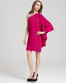 Make a dramatic entrance in this artfully designed Nicole Miller one-shoulder dress of matte silk, featuring a drama-lending batwing sleeve.