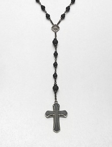 A simple, yet masculine addition to your ensemble, with a strand black onyx beads complemented by a sterling silver cross pendant.Sterling silverBlack onyxAbout 37, inner diam.About 7 dropImported A simple, yet masculine addition to your ensemble, with a strand black onyx beads complemented by a sterling silver cross pendant.Sterling silverBlack onyxAbout 37, inner diam.About 7 dropImported