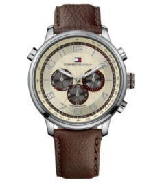 An new take on traditional, this watch by Tommy Hilfiger keeps things interesting with texture. Brown leather strap and round stainless steel case. Parchment chronograph dial with textured inner dial features silver tone numerals, three subdials, luminous hands and logo at twelve o'clock. Quartz movement. Water resistant to 50 meters. Ten-year limited warranty. An new take on traditional, this watch by Tommy Hilfiger keeps things interesting with texture. Brown leather strap and round stainless steel case. Parchment chronograph dial with textured inner dial features silver tone numerals, three subdials, luminous hands and logo at twelve o'clock. Quartz movement. Water resistant to 50 meters. Ten-year limited warranty.
