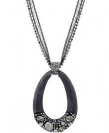 Earthy and eclectic. Kenneth Cole New York's pendant necklace is simultaneously chic and unique. Made in hematite tone mixed metal, it's embellished with an oval-shaped wood pendant and sparkling crystal accents. Approximate length: 30 inches + 3-inch extender. Approximate drop: 2-1/2 inches. Earthy and eclectic. Kenneth Cole New York's pendant necklace is simultaneously chic and unique. Made in hematite tone mixed metal, it's embellished with an oval-shaped wood pendant and sparkling crystal accents. Approximate length: 30 inches + 3-inch extender. Approximate drop: 2-1/2 inches.