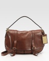 Heritage-inspired washed leather satchel, detailed with buckled straps and a golden metal tag.Top handle, 5 dropRemovable shoulder strap, 20½ dropBelted flap-and-strap closureTwo outside open pockets under the flapOne inside zip pocketOne inside open pocketOne inside cellphone pocketCanvas lining13W X 10½H X 3½Made in Italy