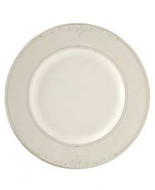 Sprinkled with subtle, stylized florals and wrapped in polished platinum bands, this bread & butter plate brings refined whimsy to your formal table in creamy fine bone china. Sprinkled with subtle, stylized florals and wrapped in polished platinum bands, this bread & butter plate brings refined whimsy to your formal table in creamy fine bone china.