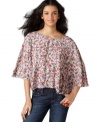 An open back spices up this oh-so spring-like BCBGeneration floral-printed top -- perfect over the season's denim!