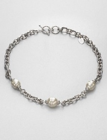 Three beautiful pearl stations on a rhodium-plated stainless steel chain link design. 14mm-16mm organic white baroque man-made pearlRhodium-plated stainless steelLength, about 17Toggle closureImported Three beautiful pearl stations on a rhodium-plated stainless steel chain link design. 14mm-16mm organic white baroque man-made pearlRhodium-plated stainless steelLength, about 17Toggle closureImported