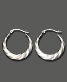 Shining swirls add dimension and texture to these 14k white gold hoop earrings. Approximate diameter: 1/2 inch.