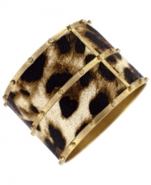 Spots are hot. Jessica Simpson's fierce bangle bracelet features a pvc leopard print set in a studded gold tone mixed metal. Approximate diameter: 3 inches.