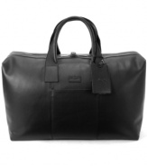 Keep calm with a carry-on! Sophisticated style and smart design meet in this take-it-all duffel. Crafted from rich, full-grain leather, this luxurious bag is the perfect pickup for quick trips or weekend getaways, packing up fast with a convenient top-zip construction.
