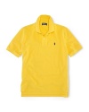 A classic polo shirt crafted from breathable cotton mesh is tailored in a short-sleeved silhouette for preppy, warm-weather style.