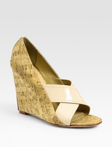 Natural cork wedge and upper add a touch of texture to polished patent leather straps. Cork wedge with patent leather insert, 4½ (115mm)Cork and patent leather upperLeather lining and solePadded insoleImportedOUR FIT MODEL RECOMMENDS ordering one half size up as this style runs small. 