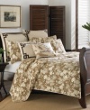 Transform your bedroom into a tropical island with this Tommy Bahama Plantation Floral Coconut quilt, featuring an allover tropical floral print in a tan hue. Pure cotton sateen is embellished with stitching details and ivory trim for luxuriant texture. Reverses to self.