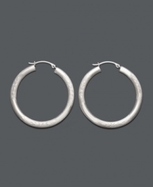 A style staple. Hoop earrings are a must-have for every wardrobe. This classic style comes in 14k white gold with a lever backing. Approximate diameter: 1-1/4 inches. A style staple. Hoop earrings are a must-have for every wardrobe. This classic style comes in 14k white gold with a lever backing. Approximate diameter: 1-1/4 inches.