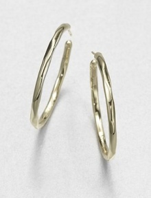 From the Glamazon Collection. Simple, sculptural hoops in subtly faceted gold are both modern and timeless.18k yellow goldDiameter, about 1.6Post backImported