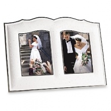 A cherished wedding keepsake. Pearl-like accents and touches of platinum give this fine frame a most romantic look. Place two 5x7 photos of the couple - together or separately - in the frame and give as a special gift. It's crafted of Lenox fine porcelain accented with precious platinum. Frame holds two 5x7 photos and is also perfect way to showcase your 5x7 wedding photo and invitation.Height: 11Width: 15 A cherished wedding keepsake. Pearl-like accents and touches of platinum give this fine frame a most romantic look. Place two 5x7 photos of the couple - together or separately - in the frame and give as a special gift. It's crafted of Lenox fine porcelain accented with precious platinum. Frame holds two 5x7 photos and is also perfect way to showcase your 5x7 wedding photo and invitation.Height: 11Width: 15