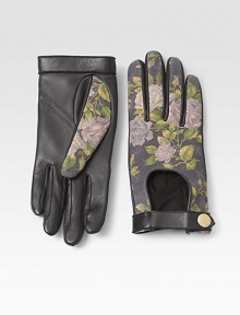 A beautiful floral design completes this biker meets babe design of ultra-soft lambskin leather.Snap-button closureLength, about 8.5LeatherDry cleanImported A beautiful floral design completes this biker meets babe design of ultra-soft lambskin leather.Snap-button closureLength, about 8.5LeatherDry cleanImported