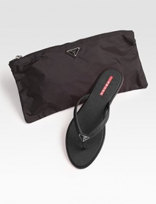 Rubber slip-on with logo detail and matching nylon cosmetic bag.Rubber sole ImportedOUR FIT MODEL RECOMMENDS ordering true whole size; ½ sizes should order the next whole size up. 