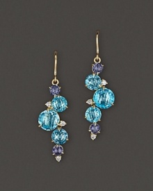 Brilliant falls of faceted iolite, blue topaz and diamond adds bright color to gleaming 18K yellow gold. By Carelle.