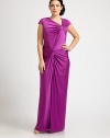 A bejeweled, floor-skimming satin gown that will turn heads this season. The gathered, twist-front bodice is especially flattering for curvy figures.Asymmetrical necklineCap sleevesJewel embellishmentGathered, twist-front bodiceConcealed back zipperAbout 46 from natural waist93% polyester/7% spandexDry cleanImported