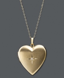 The perfect treasure. This pretty reversible pendant features a chic heart shape, sparkling diamond accent, and locket design. Crafted in 14k gold. Approximate length: 18 inches. Approximate drop: 1 inch x 3/4 inch. The perfect treasure. This pretty reversible pendant features a chic heart shape, sparkling diamond accent, and locket design. Crafted in 14k gold. Approximate length: 18 inches. Approximate drop: 1 inch x 3/4 inch.
