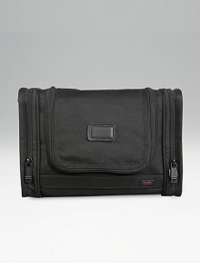 A versatile travel kit for toiletries and cosmetics that hangs from virtually any fixture, and also works on countertops. Inside mesh, zip and elastic pockets Exterior end pockets Hanging hook and carry handle Zip around entry Tumi Tracer Protection Ballistic nylon Imported 8H X 11¾W X 3D A versatile travel kit for toiletries and cosmetics that hangs from virtually any fixture, and also works on countertops. Inside mesh, zip and elastic pockets Exterior end pockets Hanging hook and carry handle Zip around entry Tumi Tracer Protection Ballistic nylon Imported 8H X 11¾W X 3D