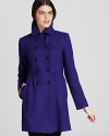 An Empire waist brings a flattering silhouette to this cozy double-breasted coat from DKNY.