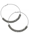 GUESS proves to be well-rounded with this pair of clutchless hoop earrings. Crafted from silver-tone mixed metal, the earrings feature silver-tone and glass crystal discs for a stunning effect. Approximate diameter: 2-1/2 inches.