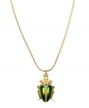 A classic symbol of good luck, RACHEL Rachel Roy's shimmering green beetle pendant will become a fave in your accessory collection. Crafted in gold-plated mixed metal with sparkling glass accents. Approximate length: 32 inches. Approximate drop: 1-1/2 inches.