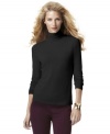 A turtleneck is an indispensable asset for any closet. INC's fitted version looks great alone or layered!