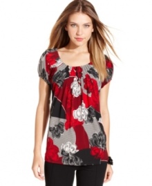 Style&co.'s floral-print top will easily add a splash of bold color to your outfit.