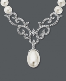 This necklace proves paisley isn't just for prints. An intricate cut-out design adorned with round-cut diamonds (3/8 ct. t.w.) and cultured freshwater pearls (8 mm x 12 mm) creates a standout look. Set in 14k white gold. Approximate length: 16 inches. Approximate drop: 1-1/2 inches. This necklace proves paisley isn't just for prints. An intricate cut-out design adorned with round-cut diamonds (3/8 ct. t.w.) and cultured freshwater pearls (8 mm x 12 mm) creates a standout look. Set in 14k white gold. Approximate length: 16 inches. Approximate drop: 1-1/2 inches.